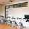 Large fitness center with large windows and plenty of equipment