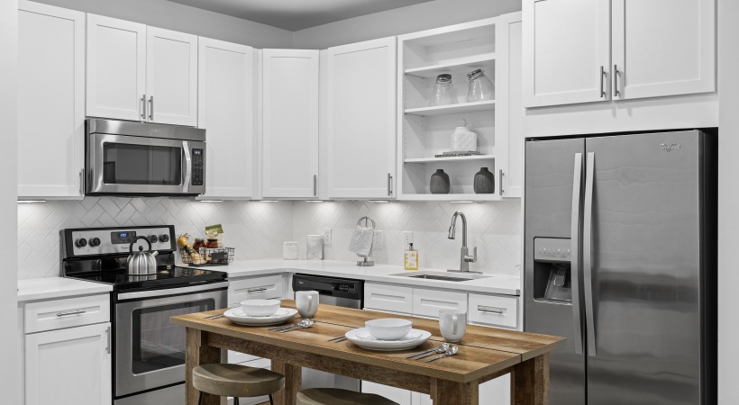 Kitchen with white cabinets and stainless steal appliances